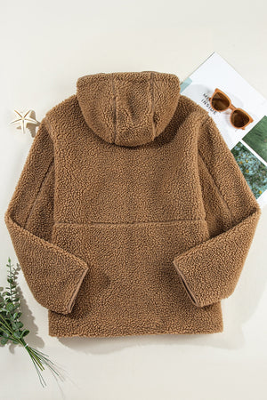 Brown sherpa hooded jacket with contrast trim and fleece lining.