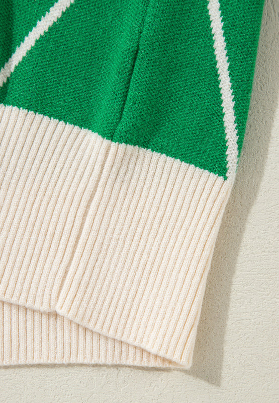Dark green argyle knit sweater with cream ribbed trim and neckline detail.