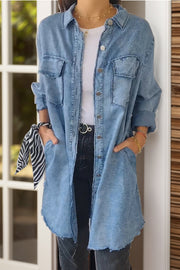 Light blue oversized denim shirt jacket with buttoned front and chest pockets.
