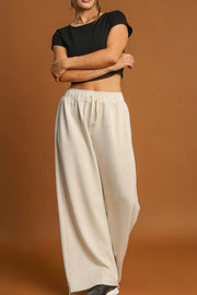 Beige wide-leg drawstring lounge pants with elastic waist