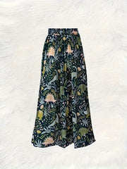 Dinosaur print elastic waist skirt in dark green with a-line cut and botanical pattern.