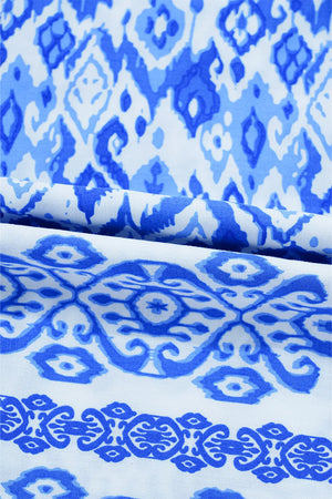 Royal blue ikat print blouse with border trim detail