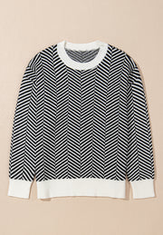 Black and white chevron knit crewneck sweater with ribbed cuffs and hem