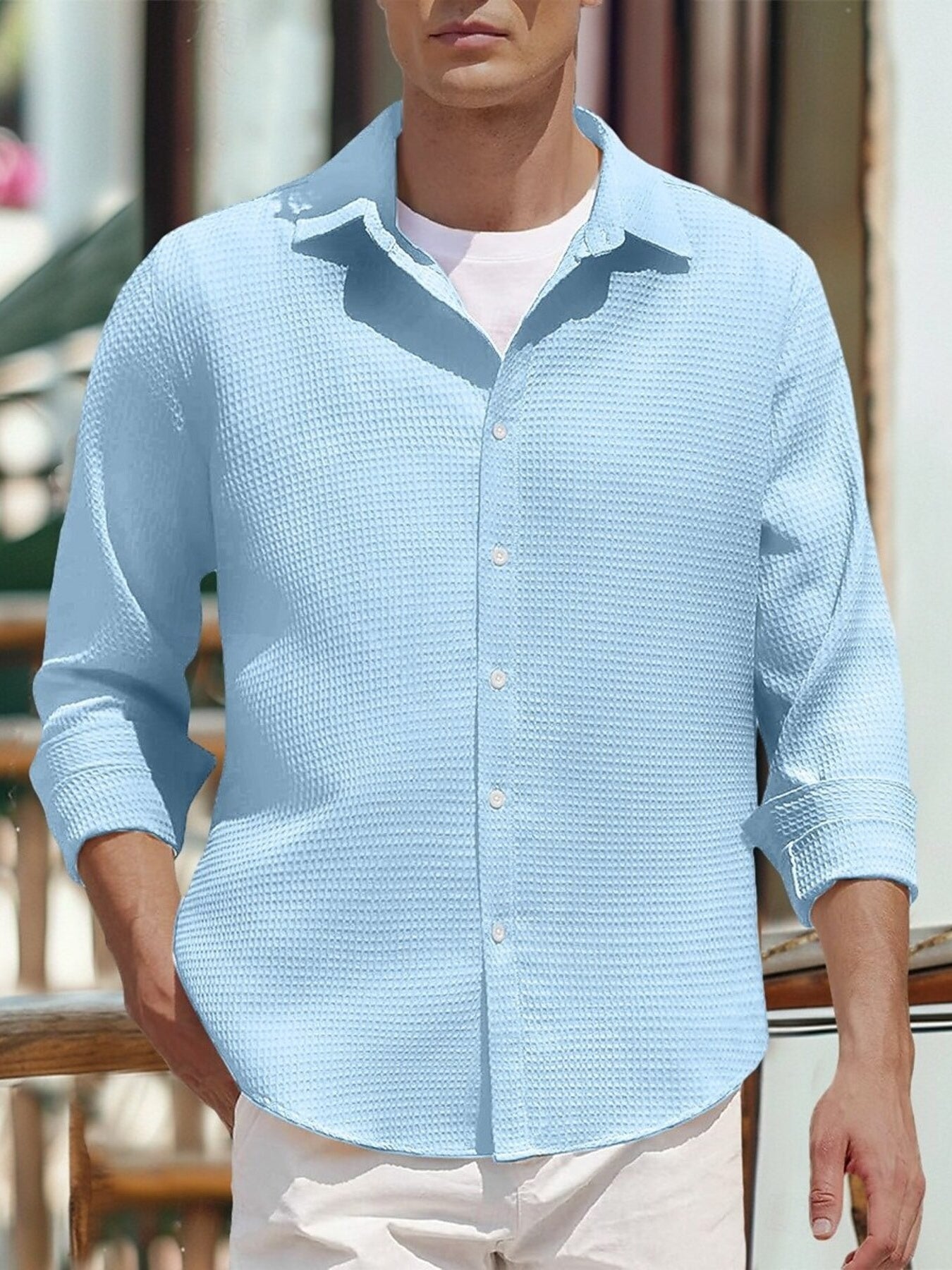 Men's sky blue waffle knit button-up shirt with a classic collar.