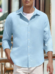 Men's sky blue waffle knit button-up shirt with a classic collar.