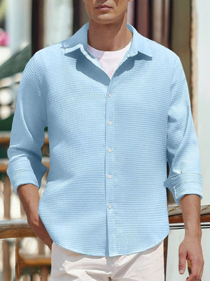 Men's sky blue waffle knit button-up shirt with a classic collar.