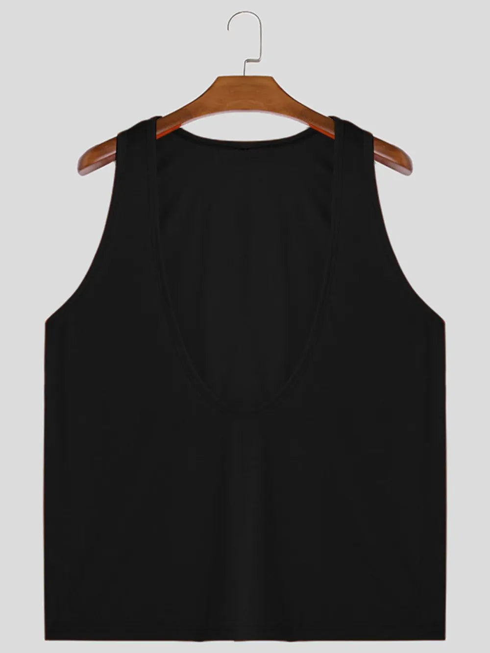 Black deep plunge tank top with wide straps and a U-neckline.