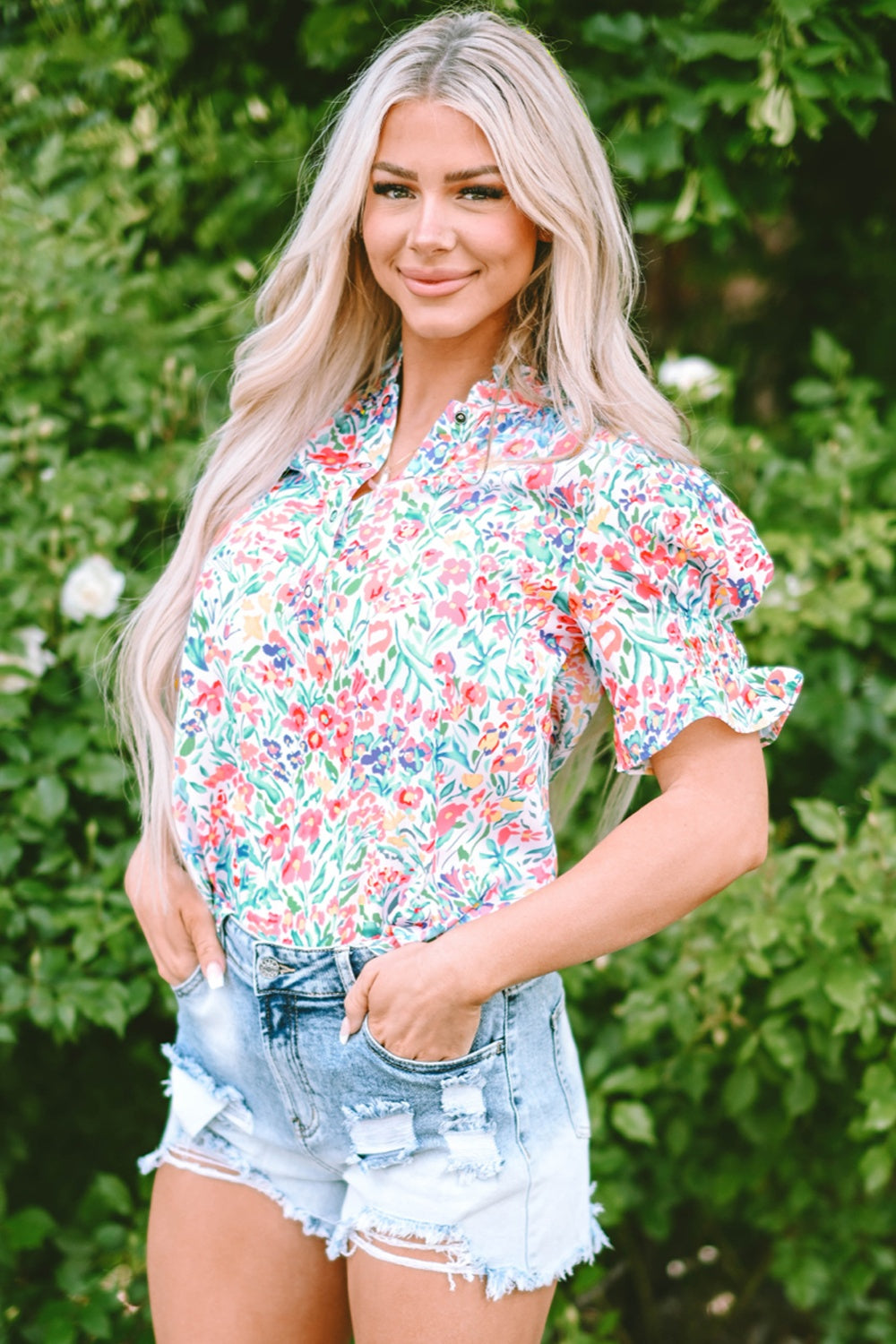 Floral ruffle collar puff sleeve blouse with a colorful floral print.