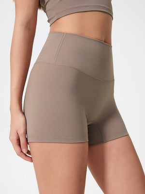 Mocha Nova Rise high-waisted active shorts with seamless detailing.