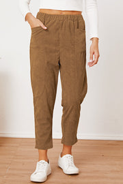 Camel corduroy barrel-leg utility pants with elastic waist and patch pockets.