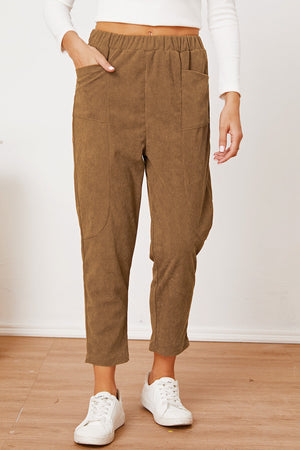 Camel corduroy barrel-leg utility pants with elastic waist and patch pockets.
