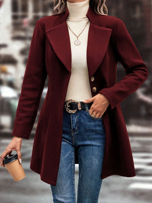 Burgundy wool coat with flared hemline, button closure, and notched lapels.