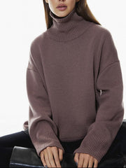 Relaxed turtleneck sweater in acrylic with sculptural sleeves and ribbed cuffs in Mocha.