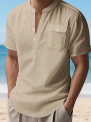 Light Khaki short sleeve henley shirt with band collar and chest pocket.