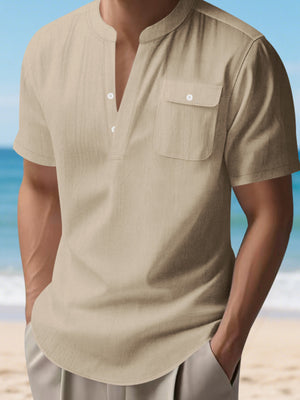 Light Khaki short sleeve henley shirt with band collar and chest pocket.