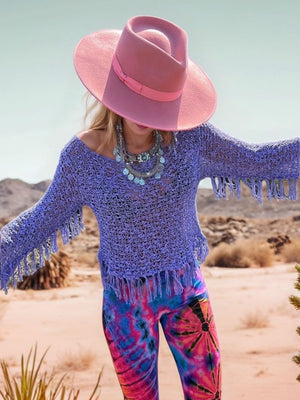 Open-knit boatneck sweater in electric purple with fringe details and bell sleeves.