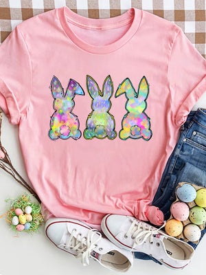 Pink t-shirt with three colorful bunny silhouettes featuring a pastel watercolor fill.
