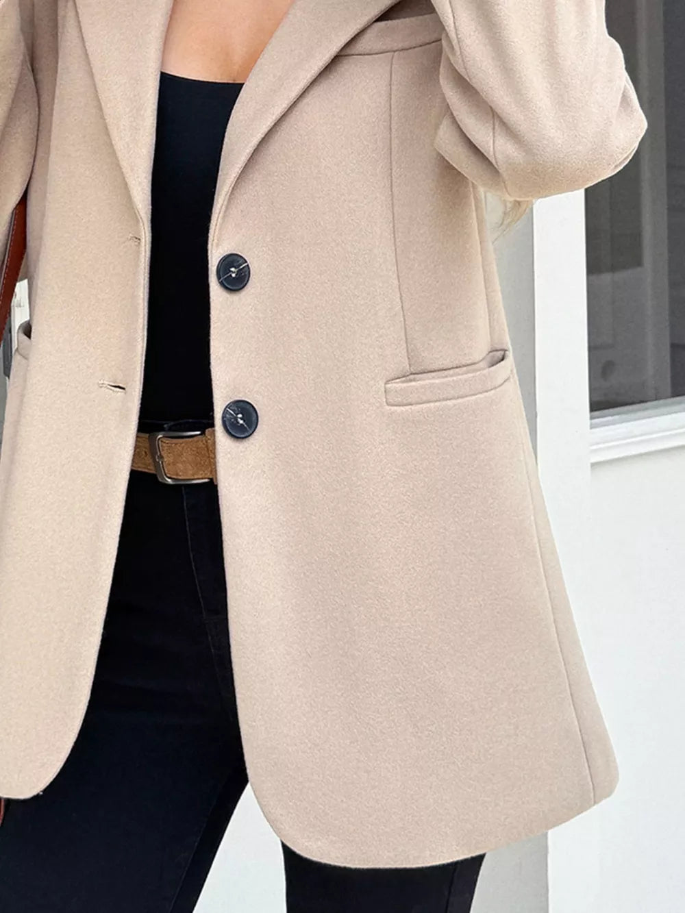 Khaki lapel blazer with two button closure and flap pocket detail.