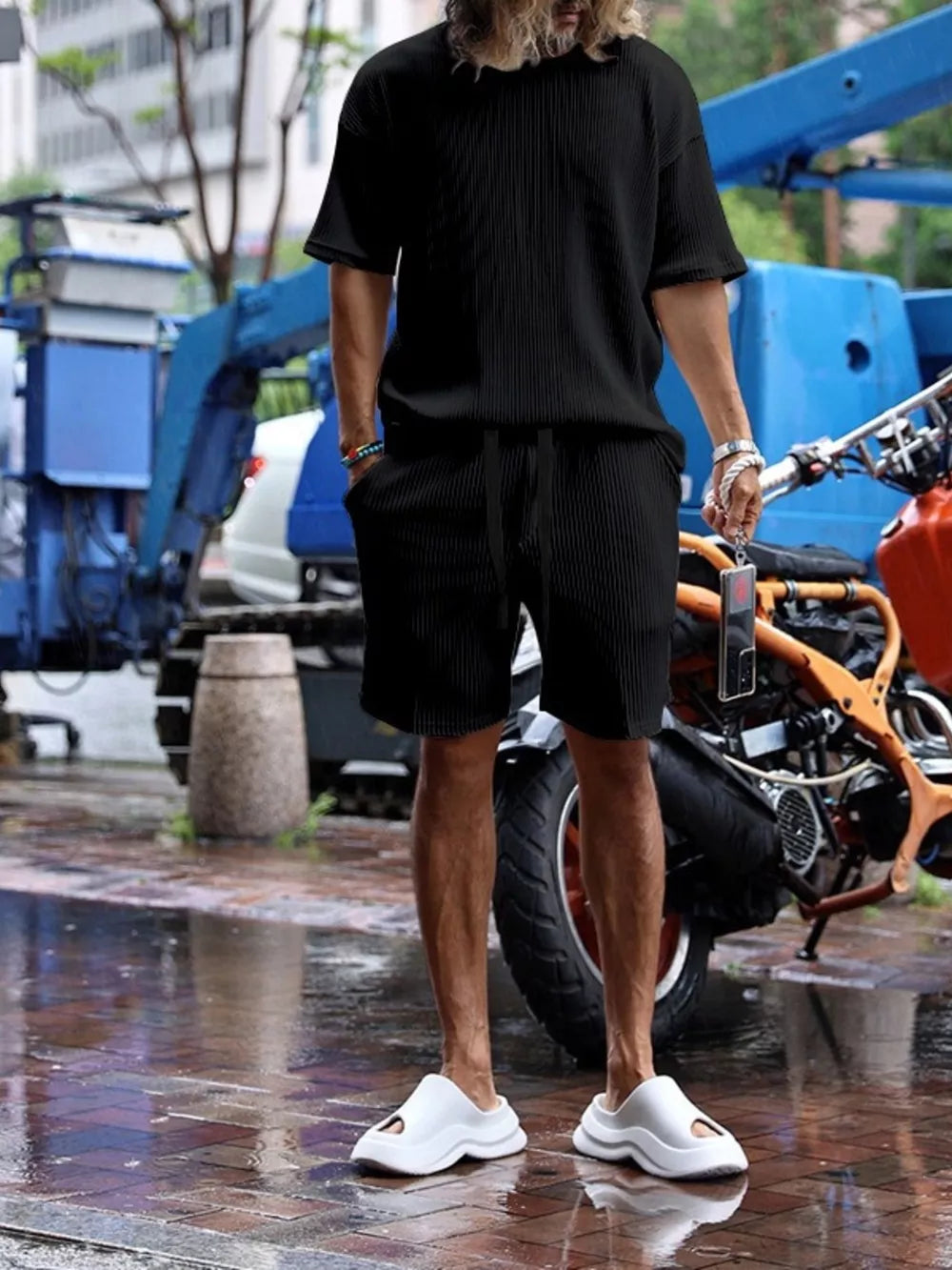 Black ribbed two-piece men's casual set with drawstring shorts and short-sleeve tee.