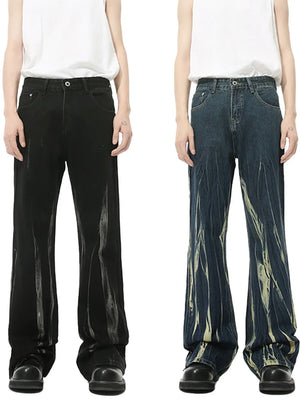 Faded flare denim jeans in black and dark blue with distressed detailing