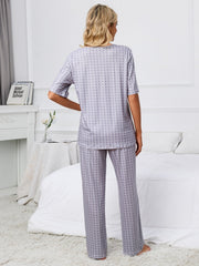 Geometric print V-neck lounge set in Cloudy Blue with short sleeves and wide-leg pants.