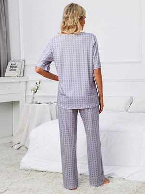 Geometric print V-neck lounge set in Cloudy Blue with short sleeves and wide-leg pants.