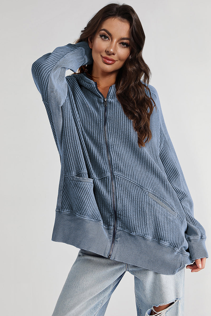 Waffle knit zip-through hoodie in blue with pockets and a relaxed fit.