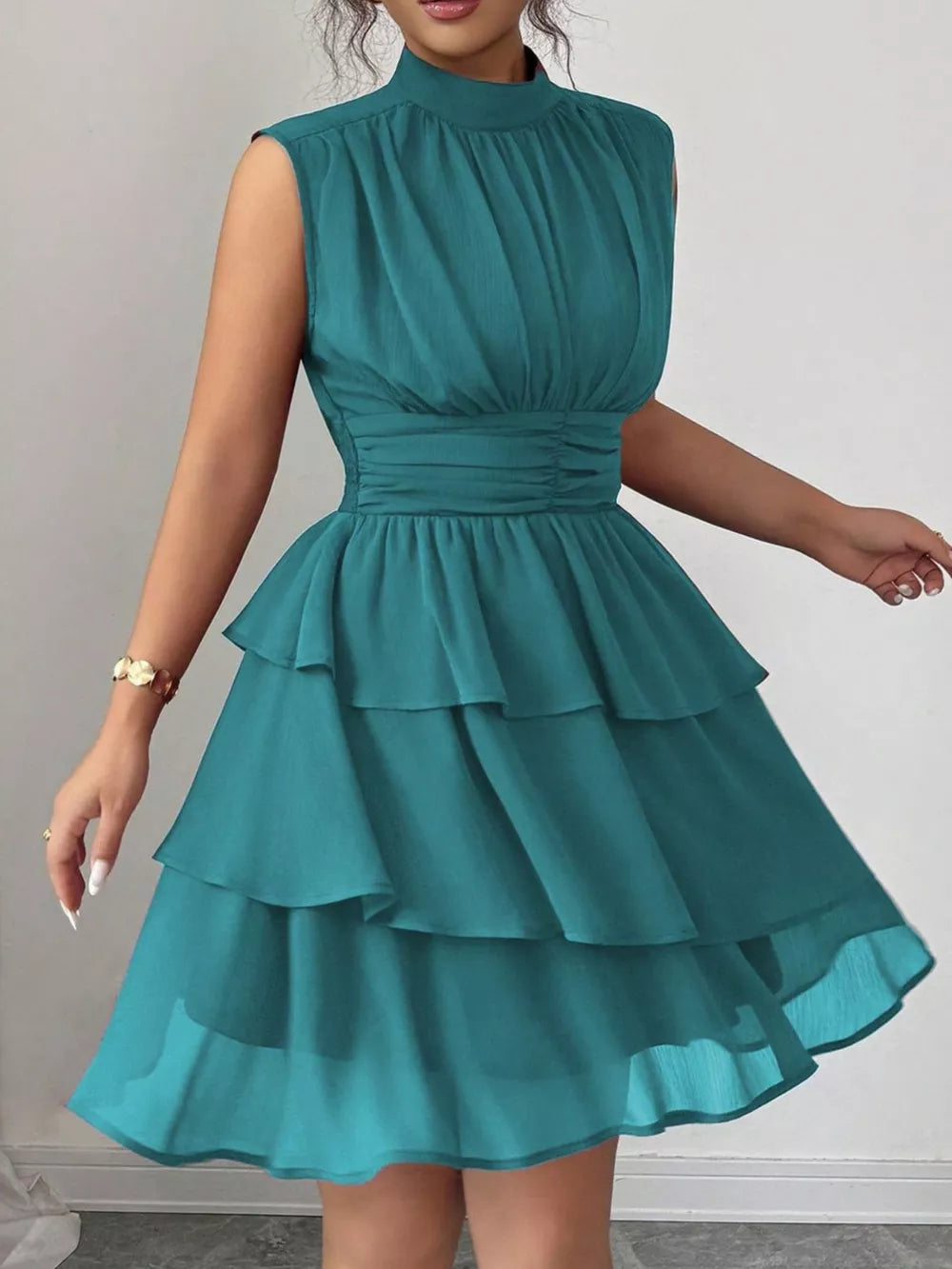 Sleeveless tiered ruffle dress in lake green with ruched waist detail
