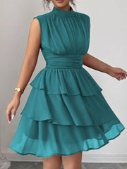 Sleeveless tiered ruffle dress in lake green with ruched waist detail