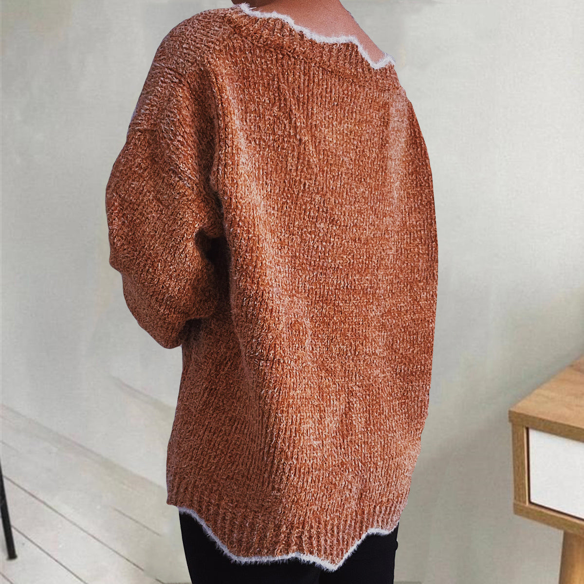 Caramel knit sweater with scalloped trim and textured acrylic fabric.