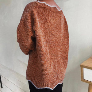 Caramel knit sweater with scalloped trim and textured acrylic fabric.