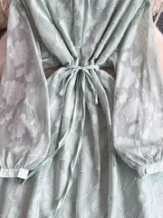 Light Green embroidered tie-waist dress with sheer floral sleeves and cinched waist.