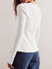 Ivory ribbed button-up second-skin top with long sleeves and a seam detail down the back.