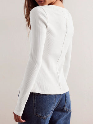 Ivory ribbed button-up second-skin top with long sleeves and a seam detail down the back.