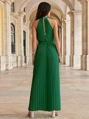 Dark green halter neckline pleated palazzo jumpsuit with back keyhole detail.