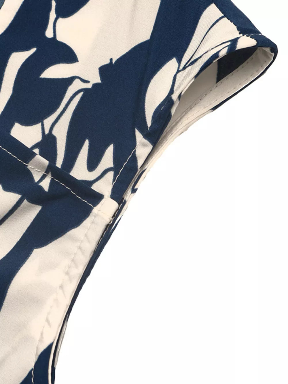 Botanical print maxi dress with cap sleeves and square neckline, detail of seam and hem.