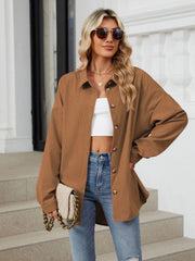 Oversized corduroy shirt jacket in brown with button front and collar.
