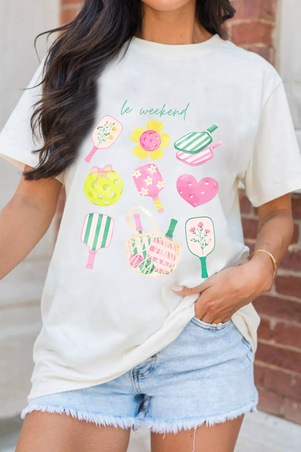 Cream polyester t-shirt with playful pickleball and floral graphic print and text le weekend