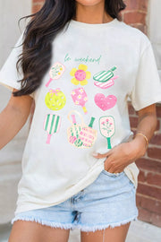 Cream polyester t-shirt with playful pickleball and floral graphic print and text le weekend