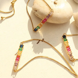 Gold chain bracelet with multicolor baguette rainbow zirconia bar and adjustable clasp