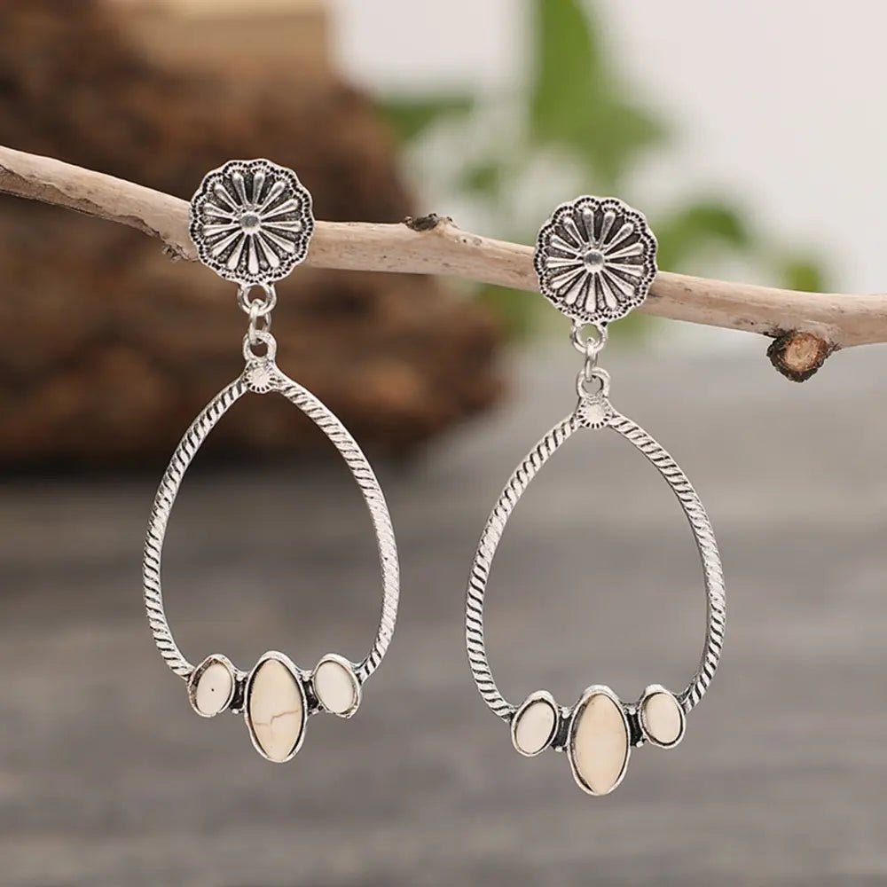 Southwestern teardrop earrings with ivory stones and silver alloy in a boho style.