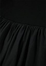 Black ribbed bodice peplum top with gathered chiffon skirt detail