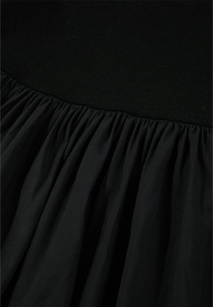 Black ribbed bodice peplum top with gathered chiffon skirt detail