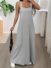 Scoop neck maxi dress in dark gray with wide straps and a flowing skirt.