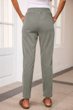Corduroy drawstring trousers in Khaki with slant pockets and a relaxed fit.