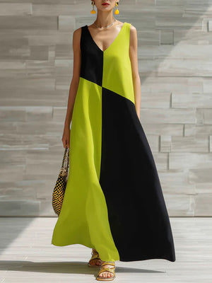 Geometric V-neck maxi dress in lime and black colorblock, sleeveless, flowy maxi skirt.