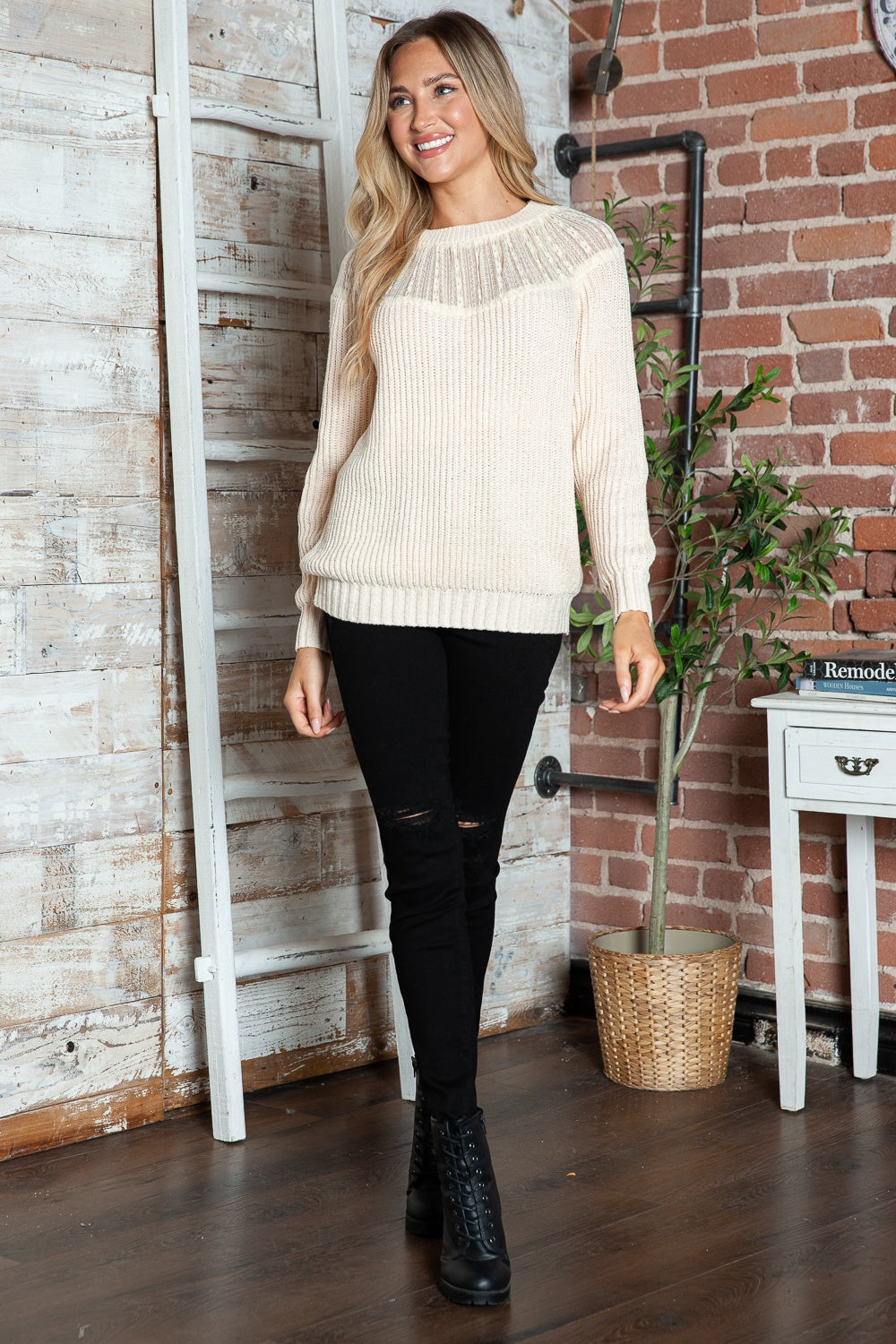 Cream ribbed knit pullover sweater with lace yoke detail and crew neck.