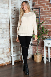 Cream ribbed knit pullover sweater with lace yoke detail and crew neck.