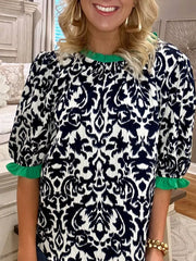 Maternity damask print blouse with green ruffled neckline and cuffs, half sleeves.