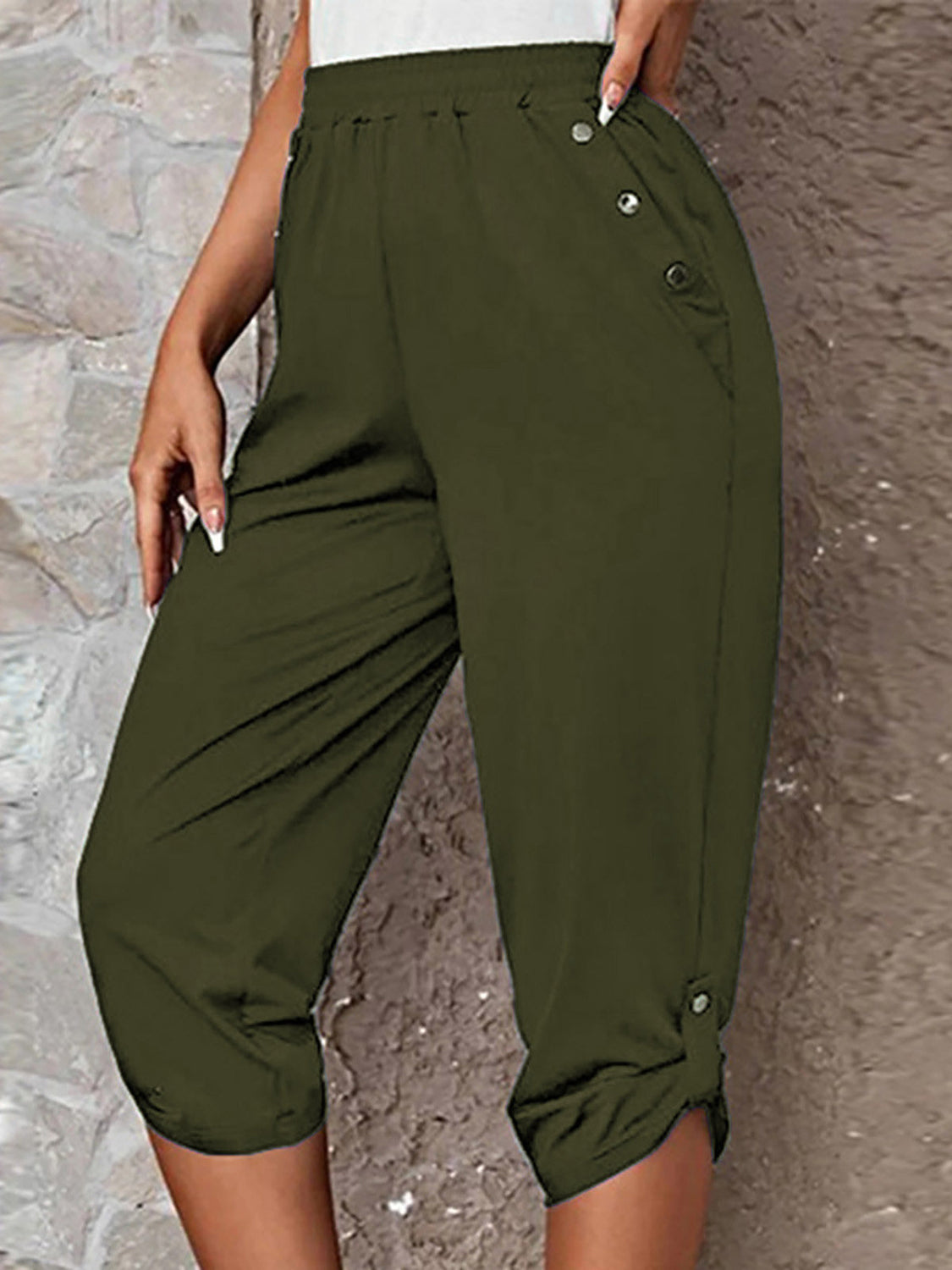 Matcha green culottes with button details and a cropped length.